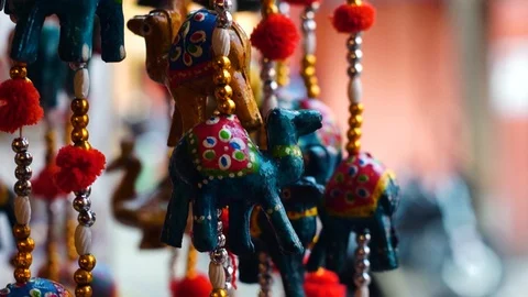 Handmade lac animals on string shot with movement and a shallow depth of feild Stock Footage 106625512