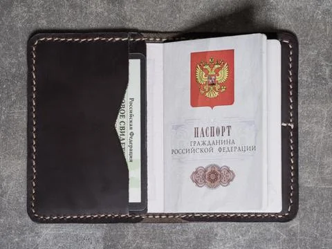 Handmade leather cover for documents with two cards and a passport Stock Photos