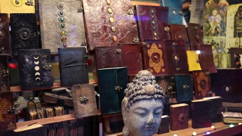 Handmade leather journals with Buddha statue Stock Footage 323700906