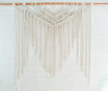 Handmade macrame pattern a fragment of a wall panel in the boho style Stock Photos