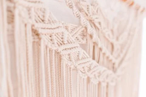 Handmade macrame pattern a fragment of a wall panel in the boho style Stock Photos