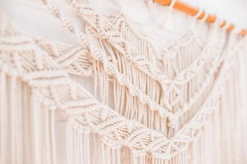 Handmade macrame pattern a fragment of a wall panel in the boho style Stock Photos