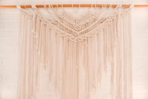 Handmade macrame pattern a fragment of a wall panel in the boho style Stock Photos