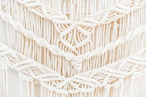 Handmade macrame pattern a fragment of a wall panel in the boho style Stock Photos