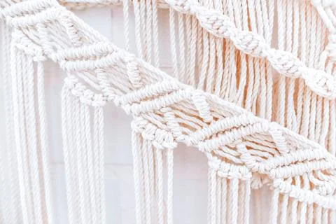 Handmade macrame pattern a fragment of a wall panel in the boho style Stock Photos