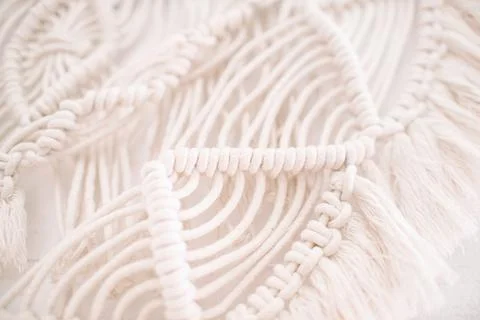 Handmade macrame pattern a fragment of a wall panel in the boho style Stock Photos