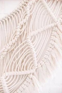 Handmade macrame pattern a fragment of a wall panel in the boho style Stock Photos