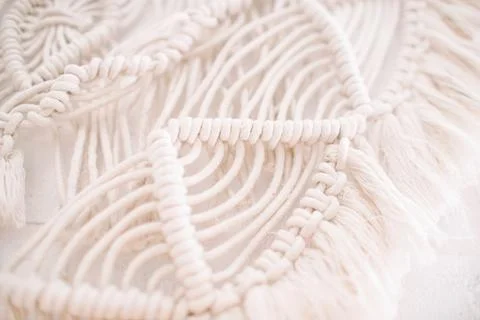Handmade macrame pattern a fragment of a wall panel in the boho style Stock Photos