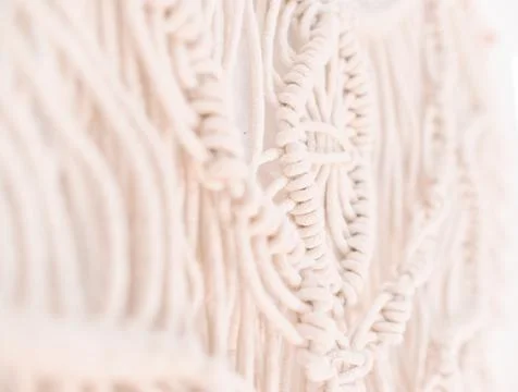 Handmade macrame pattern a fragment of a wall panel in the boho style Stock Photos