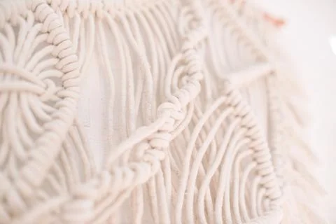 Handmade macrame pattern a fragment of a wall panel in the boho style Stock Photos