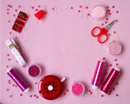 Handmade materials on a pink background. Stock Photos