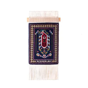 Handmade  mini carpet o a white background Stock Photos