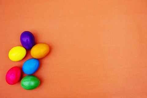 Handmade Multicolored  Easter Eggs isolated On Plain Orange Backgound Stock-Fotos