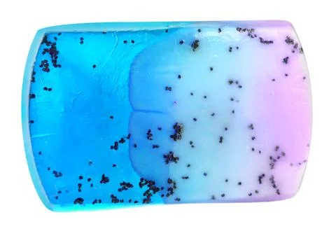 Handmade natural blue solid soap with exotic seeds, isolated on white backgro Stock Photos