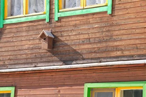 Handmade nesting house on a facade 写真素材