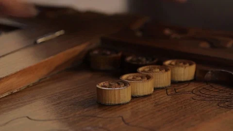 Handmade old wooden backgammon. Men play with checkers, move them to the field. Stock Footage 122298488