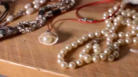 Handmade Ornament Crafting with Shells, pearls and Decorative Materials Stock Footage 337865066