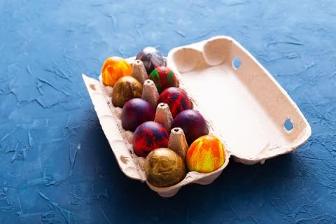 Handmade painted Easter eggs in egg box Stock Photos