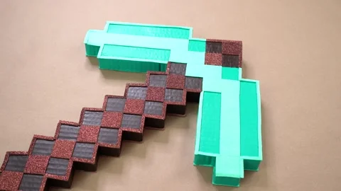 Handmade paper arts craft in shape of a pickaxe Stock Footage 328160747