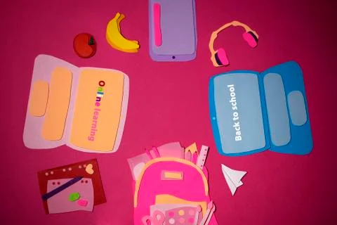 Handmade paper colored laptops, tablet and school supplies on a red background Stock Photos