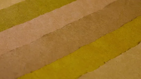 Handmade paper texture with diagonal stripes in olive green, beige and yellow. Stock Footage 330265475