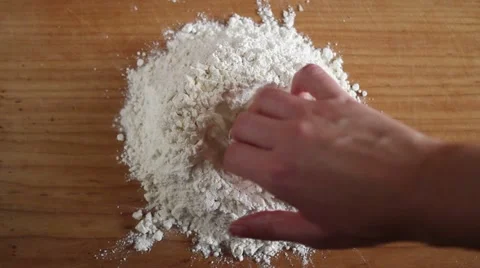 Handmade pasta preparation - preparing a hole for the egg Stock-Footage 47211944