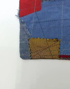 Handmade patchwork coaster with visible seams Stock Photos