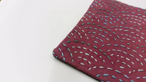 Handmade patchwork coasters and sashiko textiles flat lay.  Stock Photos