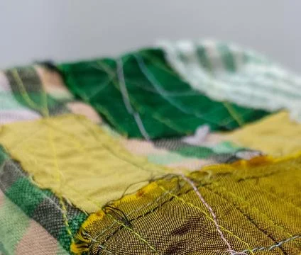 Handmade patchwork fabric texture close view.  库存照片