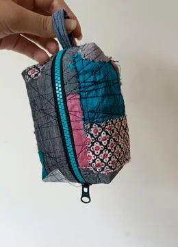 Handmade patchwork zipper pouches created from reclaimed textiles and fabric scr Stock Photos