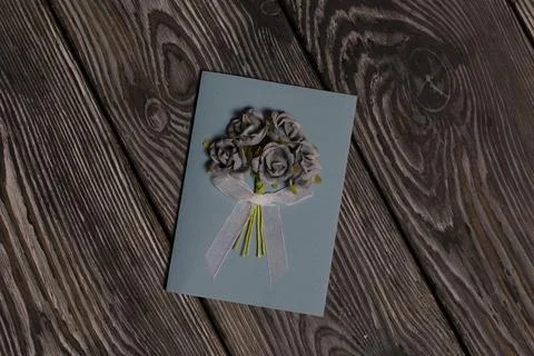 Handmade postcards. With decorative elements in the form of flowers and ribbo Stock Photos