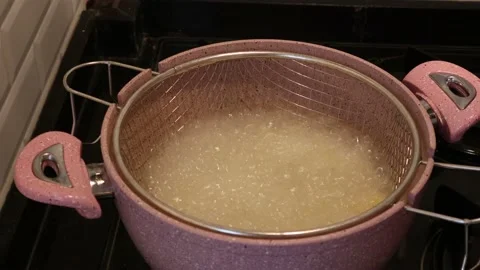 Handmade Potato Chips Are Thrown Into Hot Oil Stock Footage 148684286