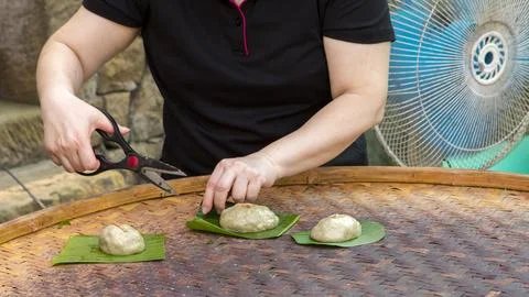 Handmade, pruning, scissors, grass cake, plantain leaves Stock Photos