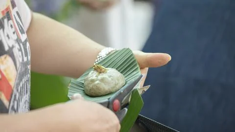 Handmade, pruning, scissors, grass cake, plantain leaves 스톡 사진