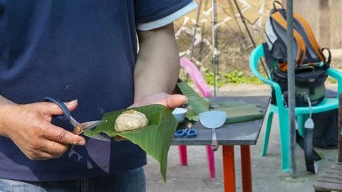 Handmade, pruning, scissors, grass cake, plantain leaves Stock Photos