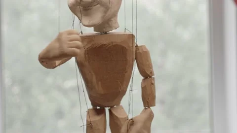 Handmade puppet doll on the strings close up Stock Footage 220879553