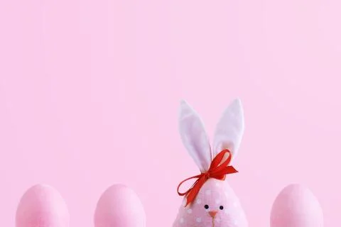 Handmade rabbit among Easter eggs, concept of celebration and fun. Stock Photos