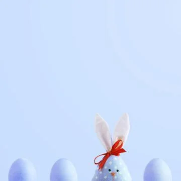 Handmade rabbit among Easter eggs, concept of celebration and fun. 库存照片