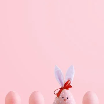 Handmade rabbit among Easter eggs, concept of celebration and fun. 库存照片