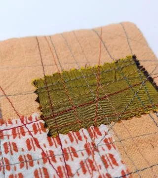 Handmade recycled cloth patchwork coaster Stock Photos