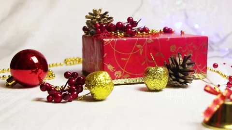 Handmade red gift boxes and Christmas decorations with shimmering lanterns Video stock 82407613