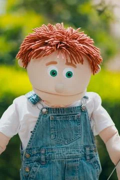 Handmade red haired cloth doll outdoors Foto stock
