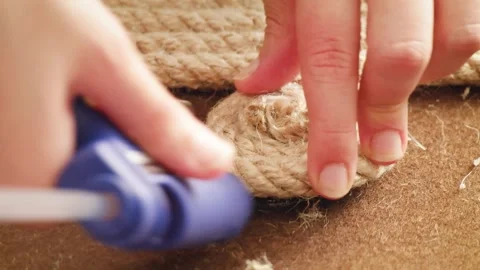 Handmade rope being rolled with a hand Vídeos de archivo 242468518