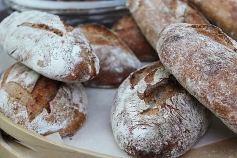 Handmade rustic bread in a tray Stock Photos