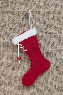 Handmade santa boot on burlap background for christmas Stock Photos