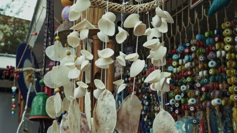 Handmade Seashell Wind Chimes and Coastal Ornaments at a Souvenir Shop Stock Footage 334157318