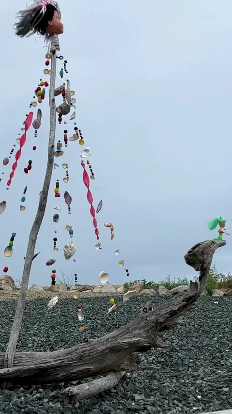 Handmade ship made from dry branches Seashell beads and a pirate flag Against Stock Footage 244440327