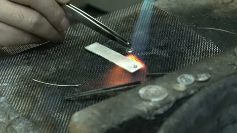 Handmade silver necklace making. silver necklace welding in jeweler shop Stock Footage 139666696
