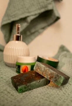 Handmade Soap Bars Resting on a Soft Green Towel Stock Photos