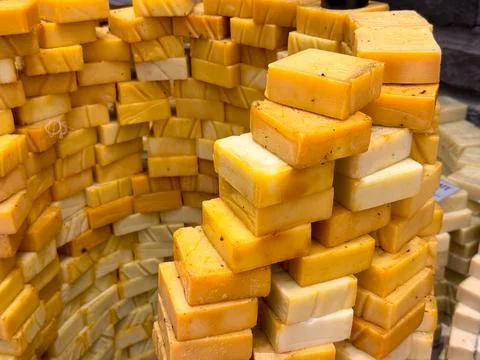 Handmade soap bars stacked tightly in geometric formations with warm natura.. 写真素材